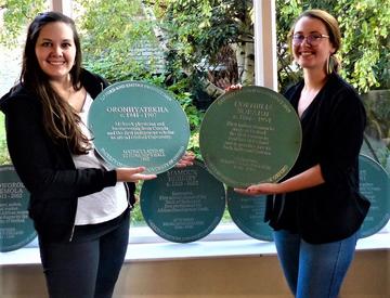 Paula Larsson and Olivia Durand unveil the plaques